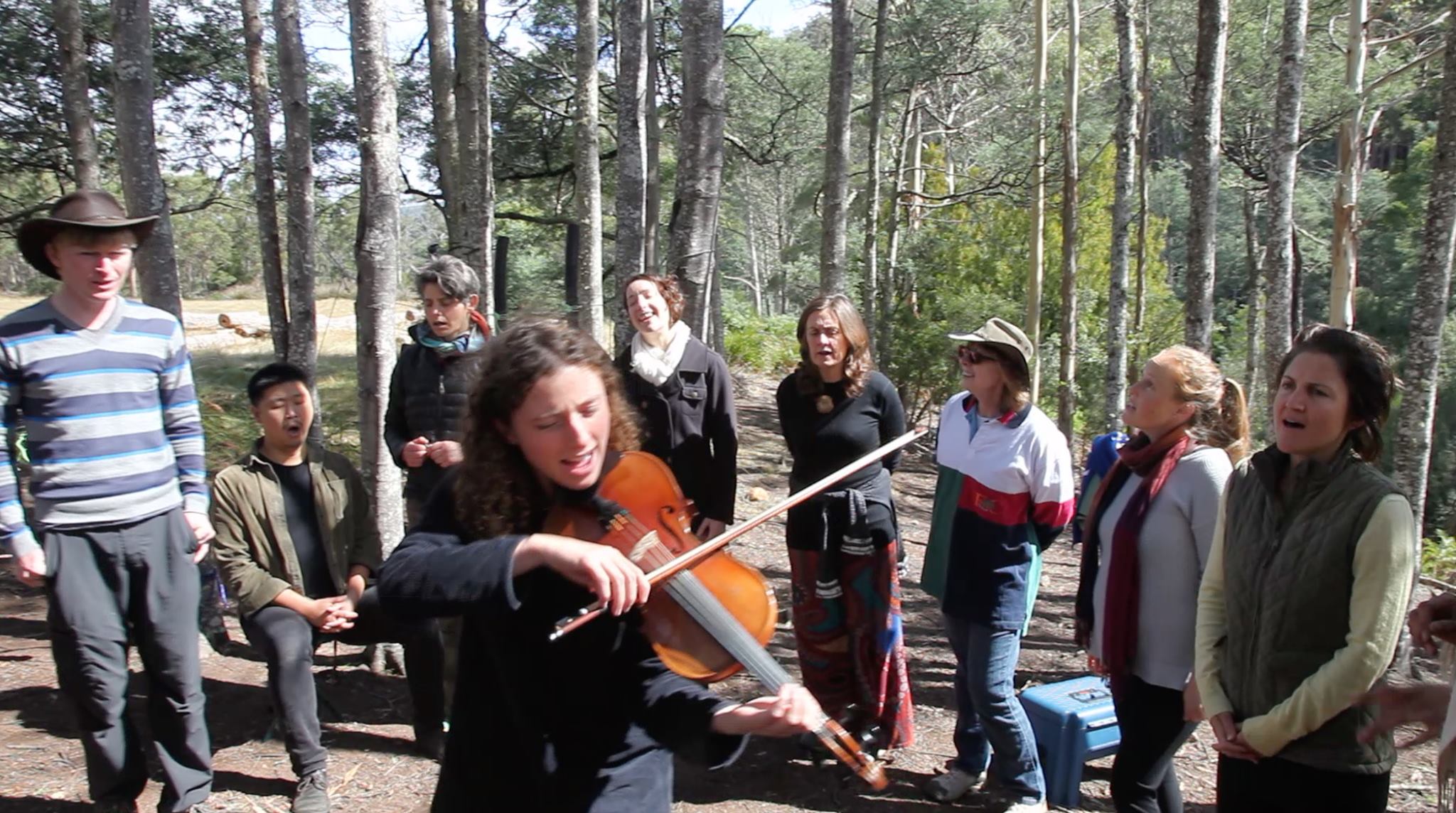 Skyglass conduct a workshop for choristers in a forest in Tassie